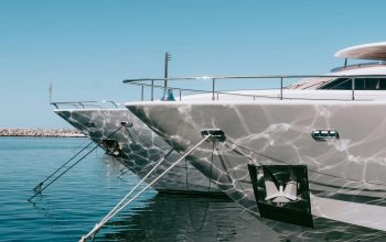 Stylish yachts docked at Marbella's sunny marina, reflecting ocean tranquility.